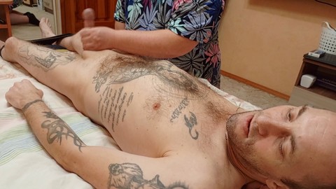 Mother-in-law gives back massage and ends with cock massage and self-pleasure